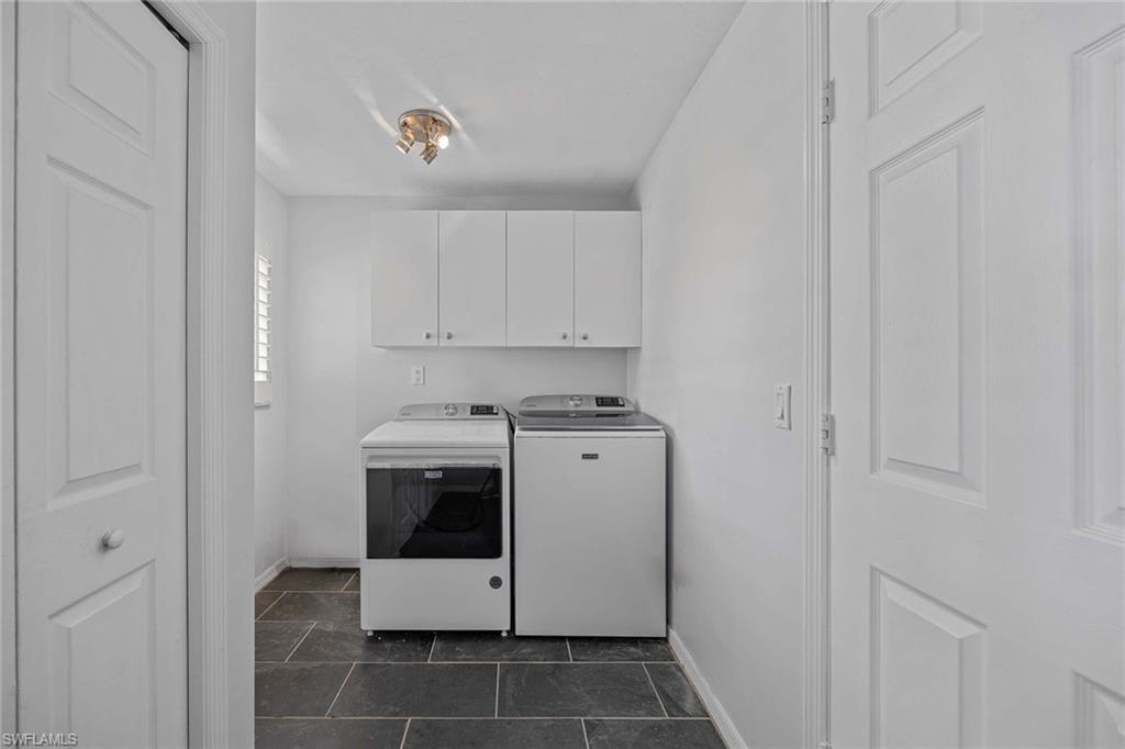 707 Portside Drive Naples, FL 34103 - Photo 31 of 35 a utility room with dryer and washer