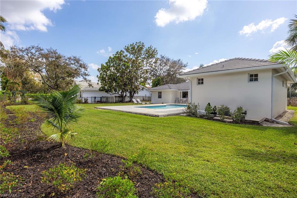 707 Portside Drive Naples, FL 34103 - Photo 34 of 35 a house view with a garden space