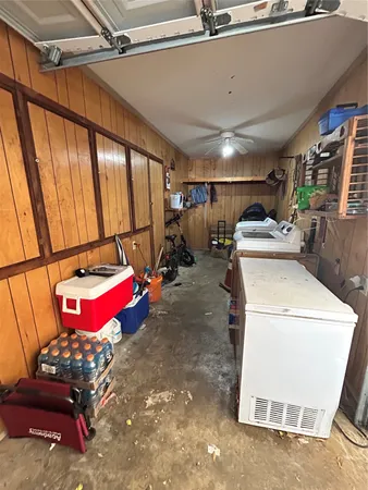 a view of swimming pool with lawn chairs and couches