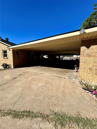a view of a backyard with sitting area