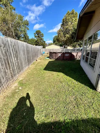 a view of a backyard with sitting area