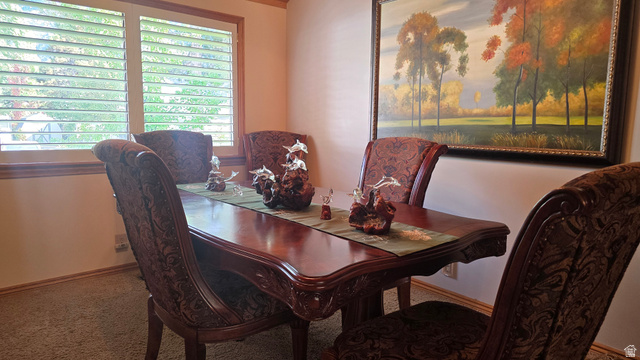 11077 Susan Drive Sandy, UT 84092 - Photo 13 of 20 Carpeted dining space with baseboards