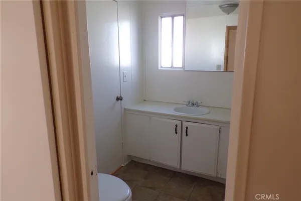 a bathroom with a sink toilet and vanity