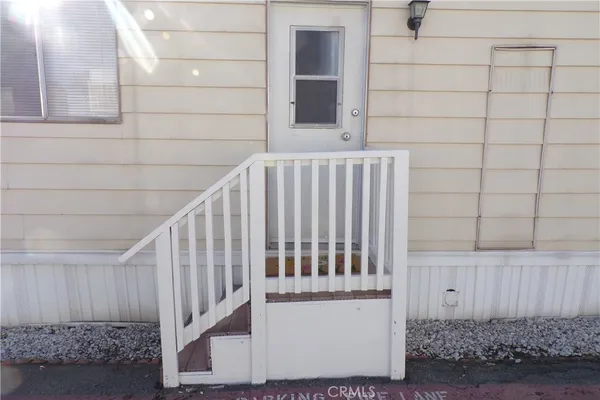 a view of wooden floor and a window