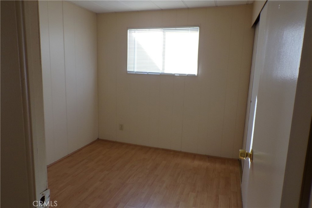12710 3rd Street, Unit 32 Yucaipa, CA 92399 - Photo 9 of 14 an empty room with a window