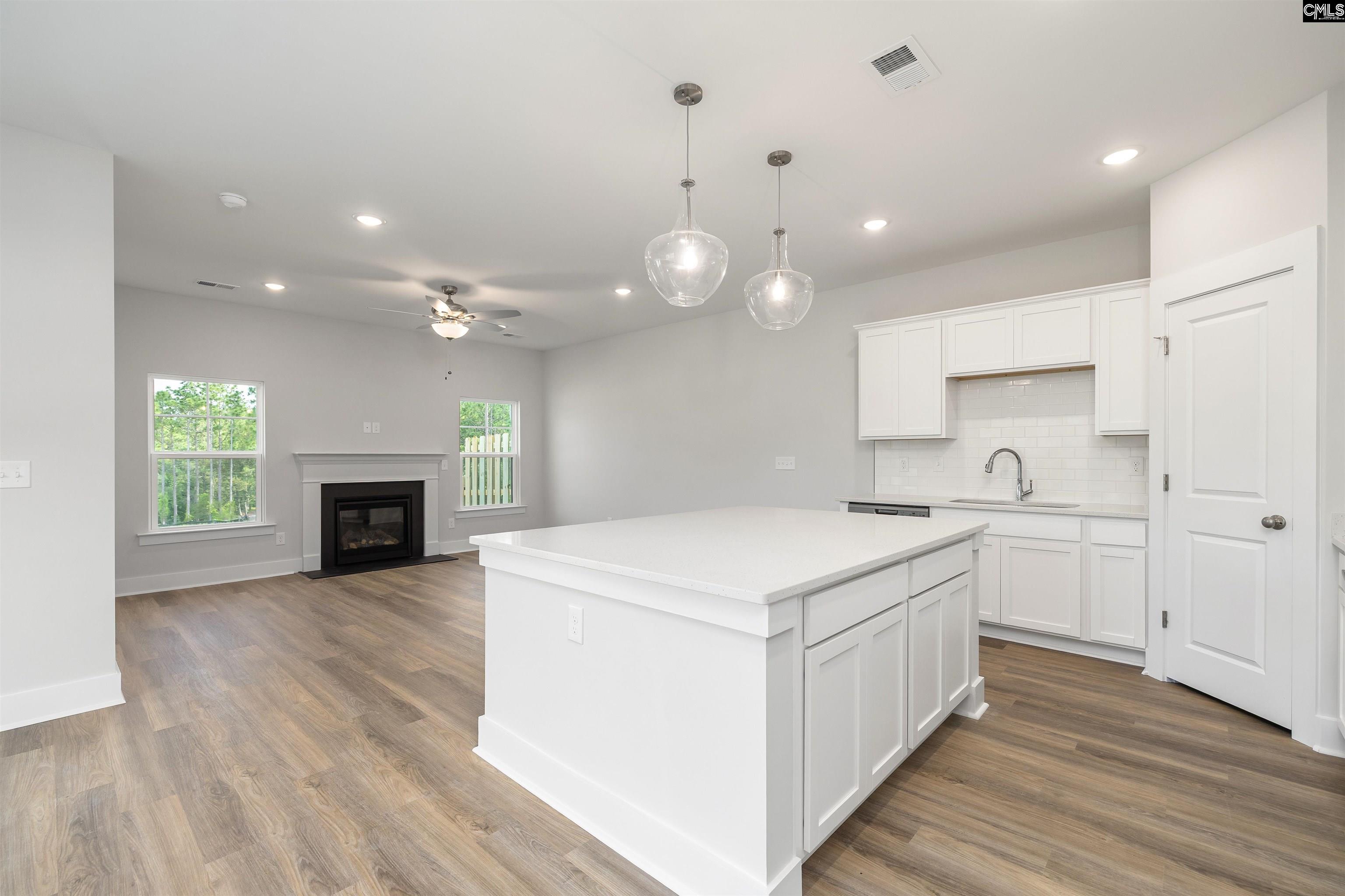 32 Fawn Spot Court Elgin, SC 29045 - Photo 7 of 28 a kitchen with a sink and a stove top oven