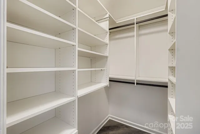 a view of an empty walk in closet