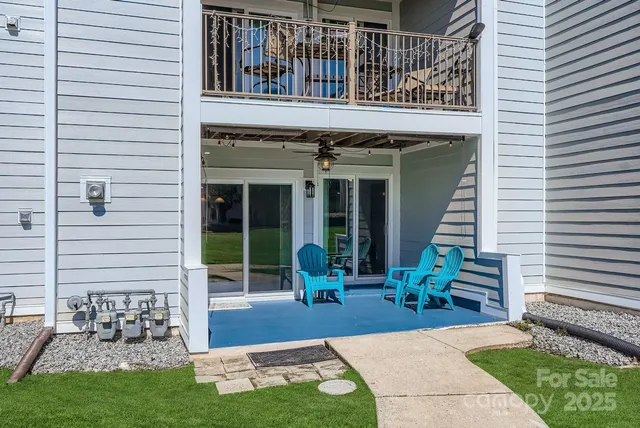 a front view of a house with garden and plants
