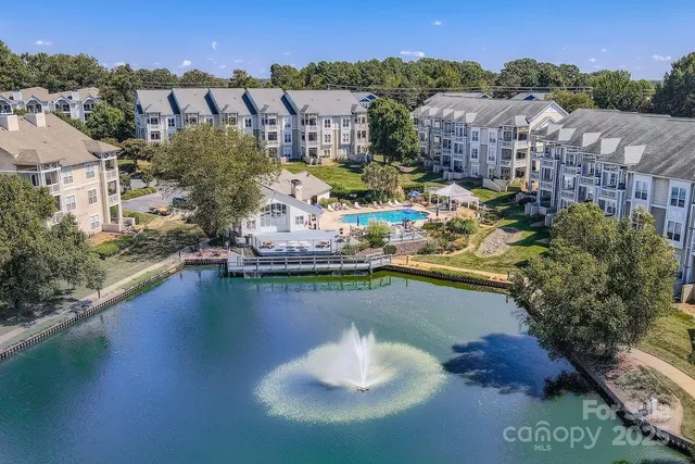 a aerial view of a house with a lake view