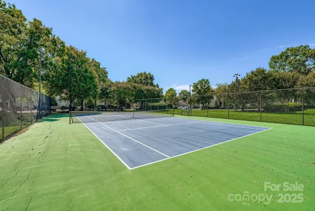 a view of a building with a yard and a fountain