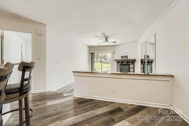 a view of living room with wooden floor and chair
