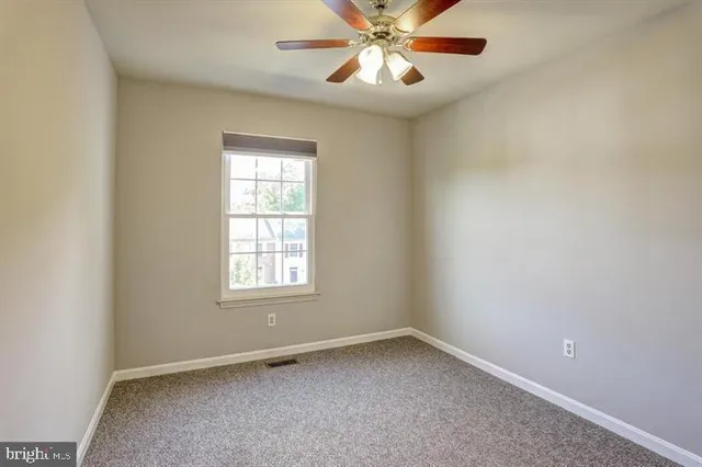 a bathroom with a shower and a toilet