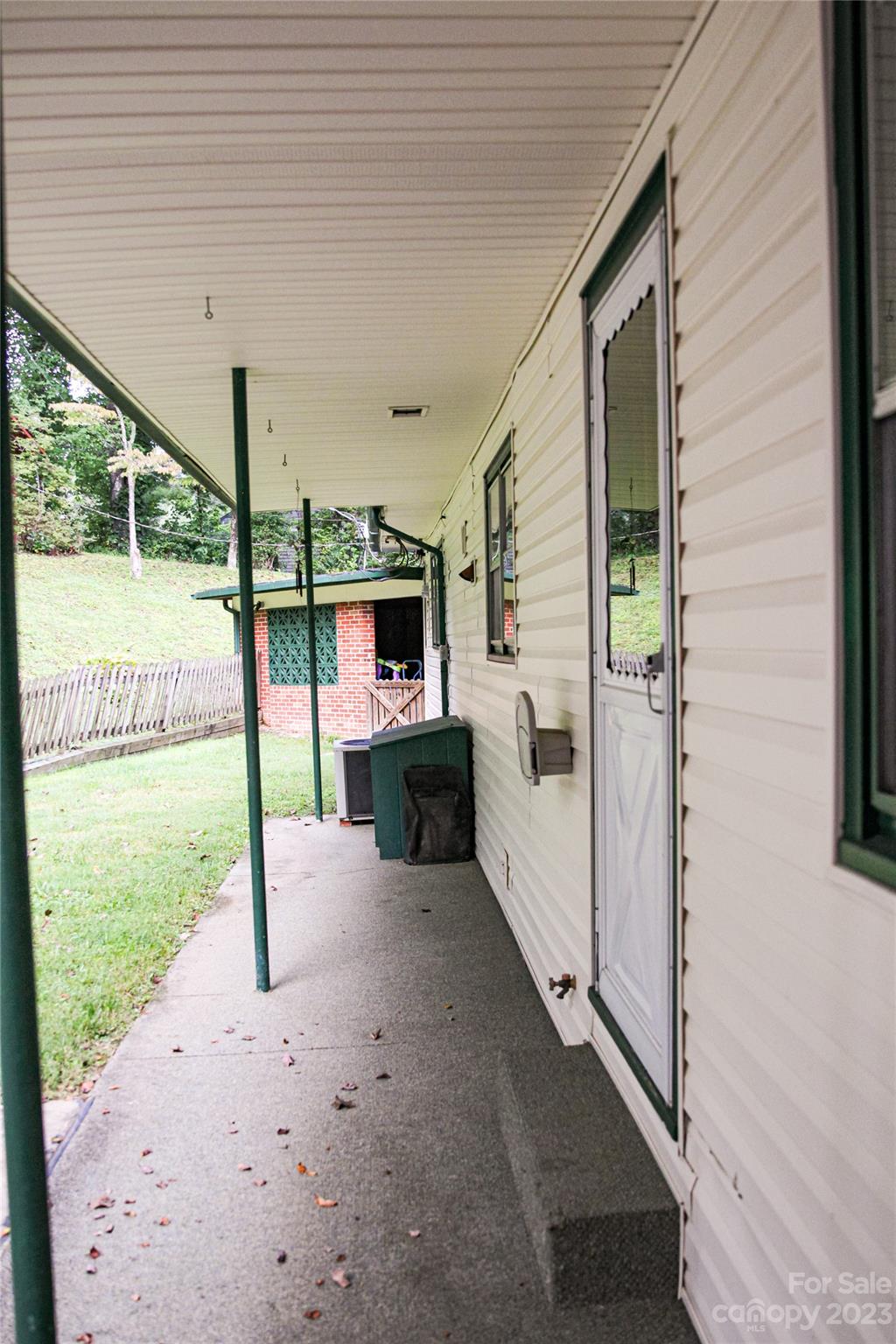 35 Rhododendron Avenue Spruce Pine, NC 28777 - Photo 13 of 37 a view of a porch with furniture