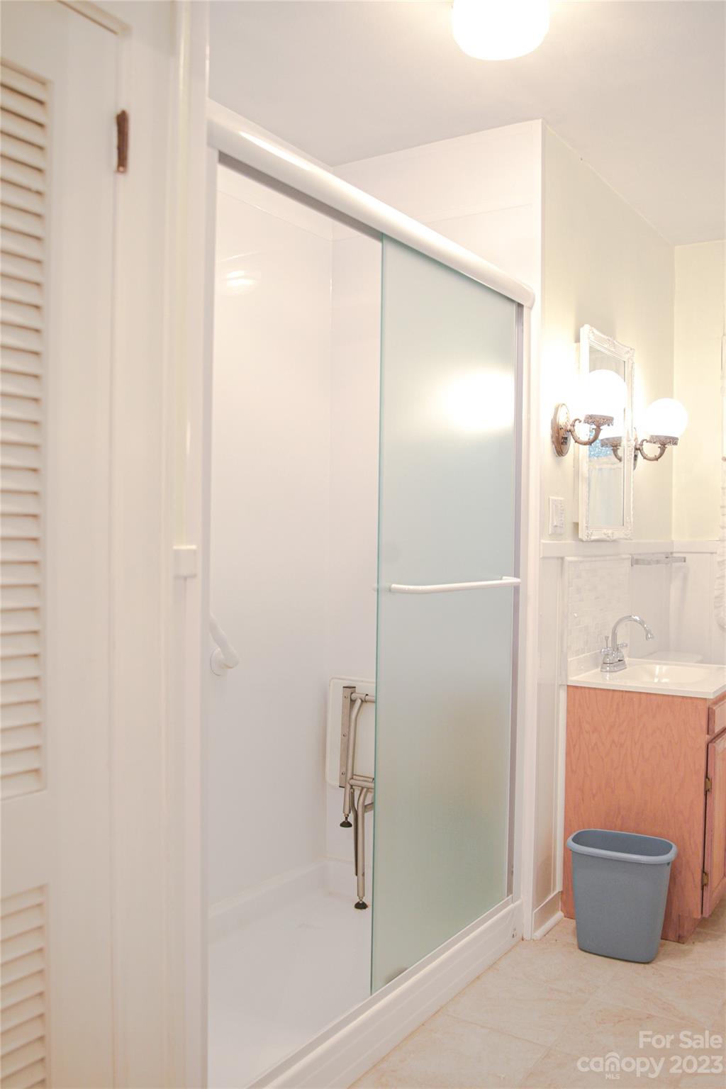 35 Rhododendron Avenue Spruce Pine, NC 28777 - Photo 18 of 37 a bathroom with a shower and a sink