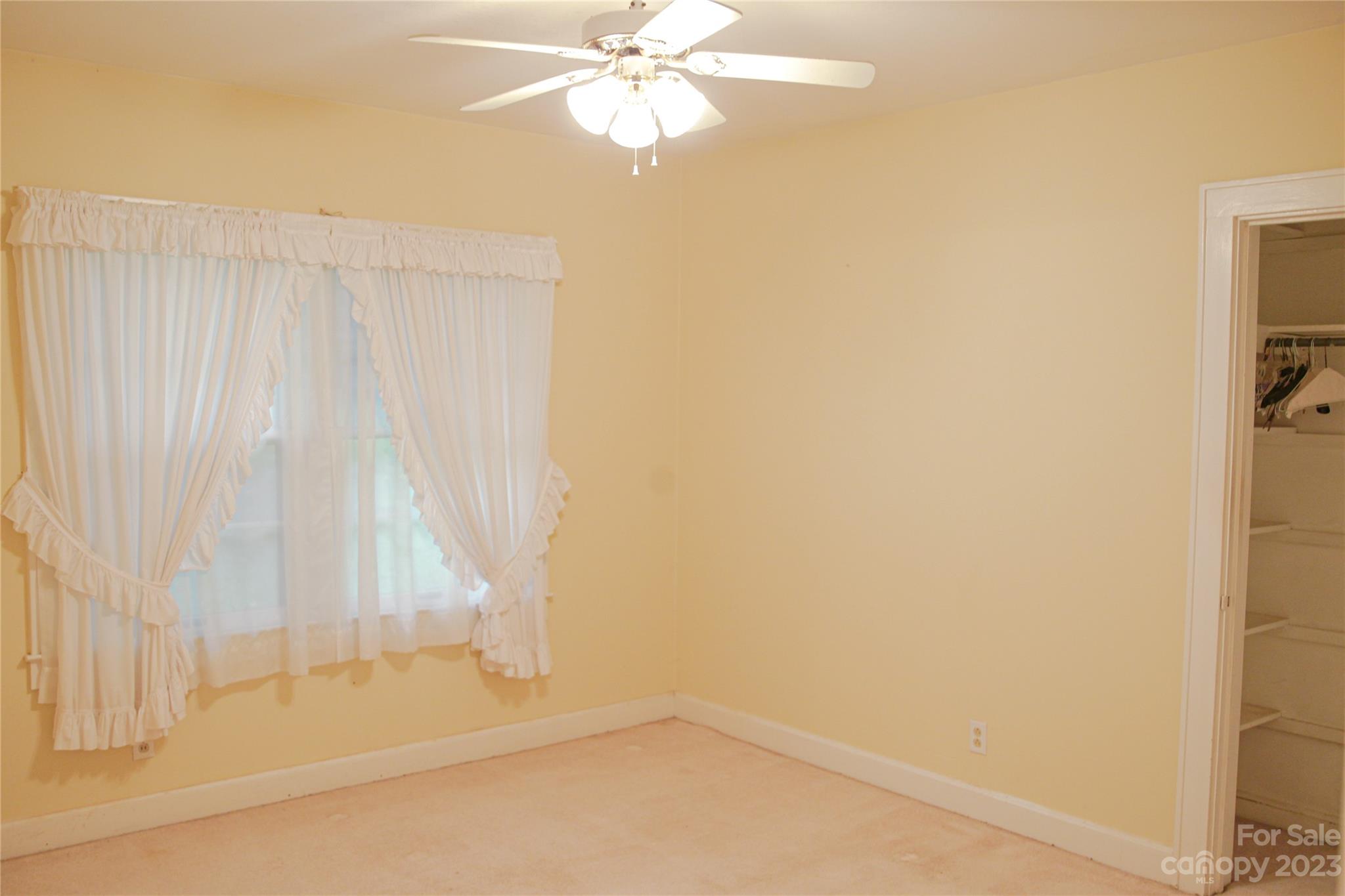 35 Rhododendron Avenue Spruce Pine, NC 28777 - Photo 21 of 37 a bathroom with a bathtub and a shower