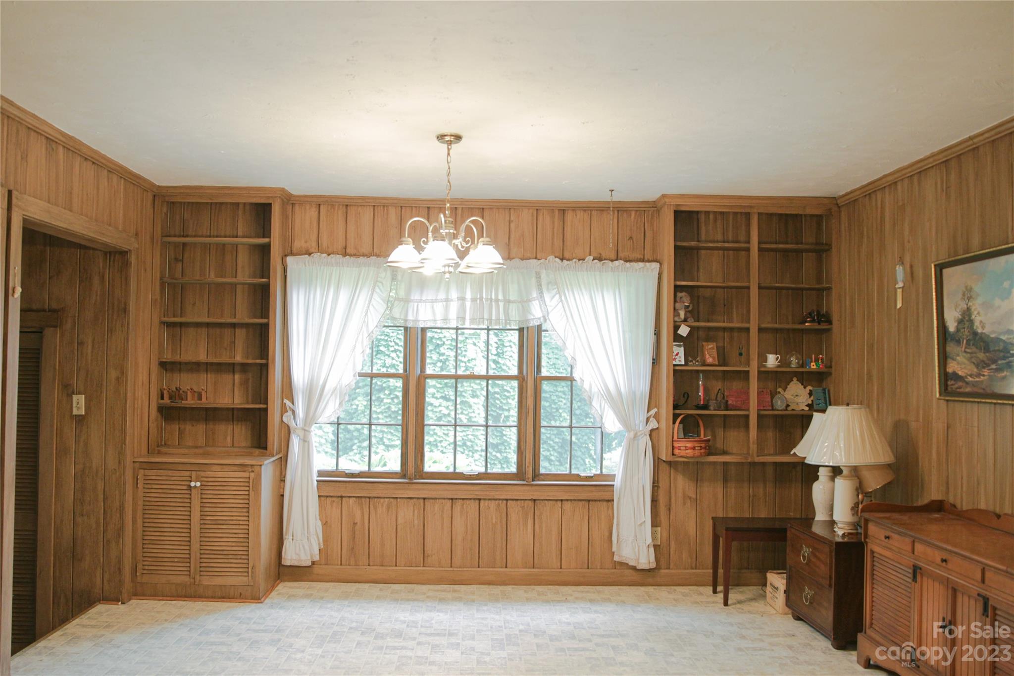 35 Rhododendron Avenue Spruce Pine, NC 28777 - Photo 26 of 37 an empty room with windows and cabinet