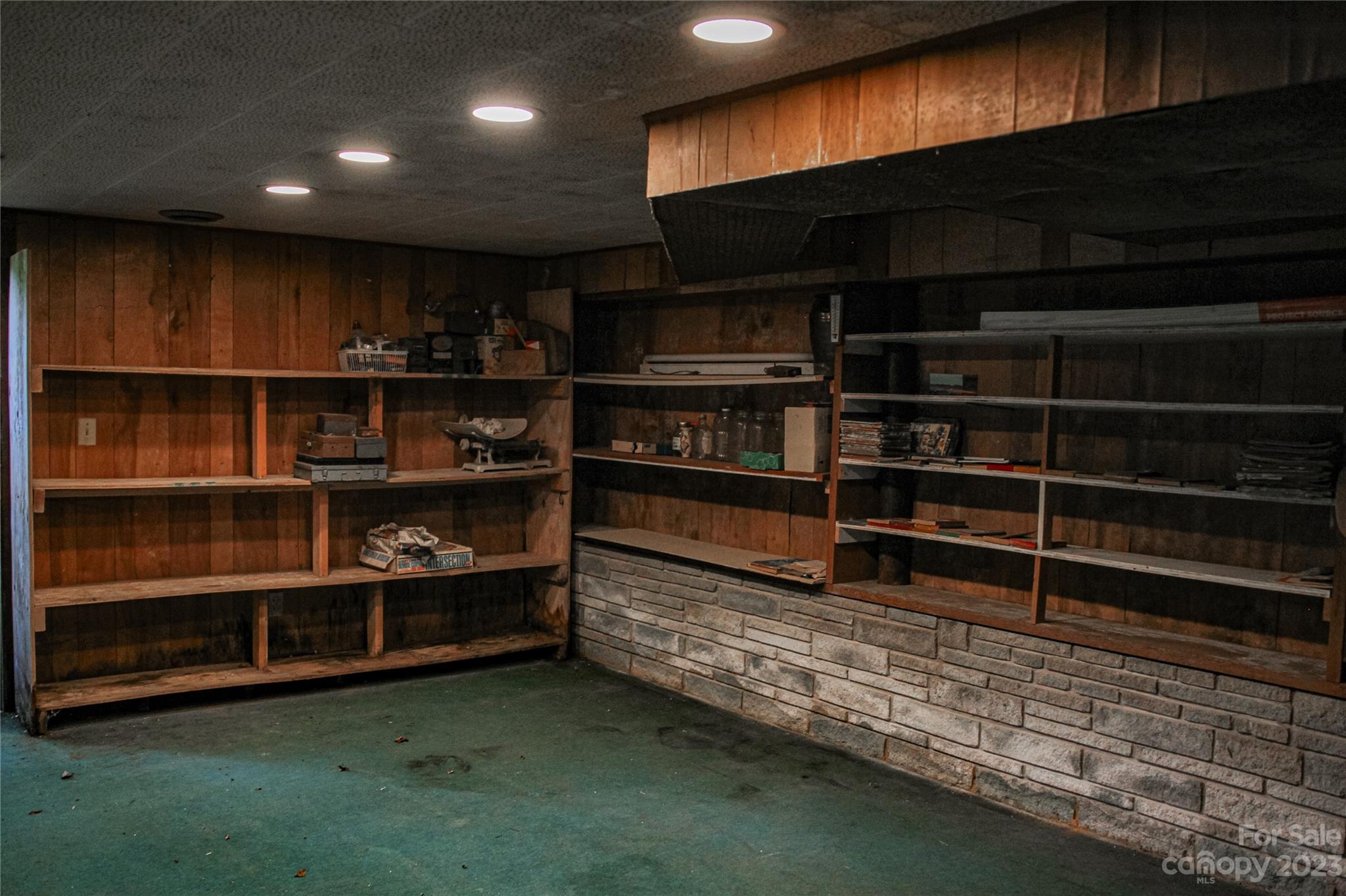 35 Rhododendron Avenue Spruce Pine, NC 28777 - Photo 29 of 37 a view of storage and utility room with wooden floor and windows