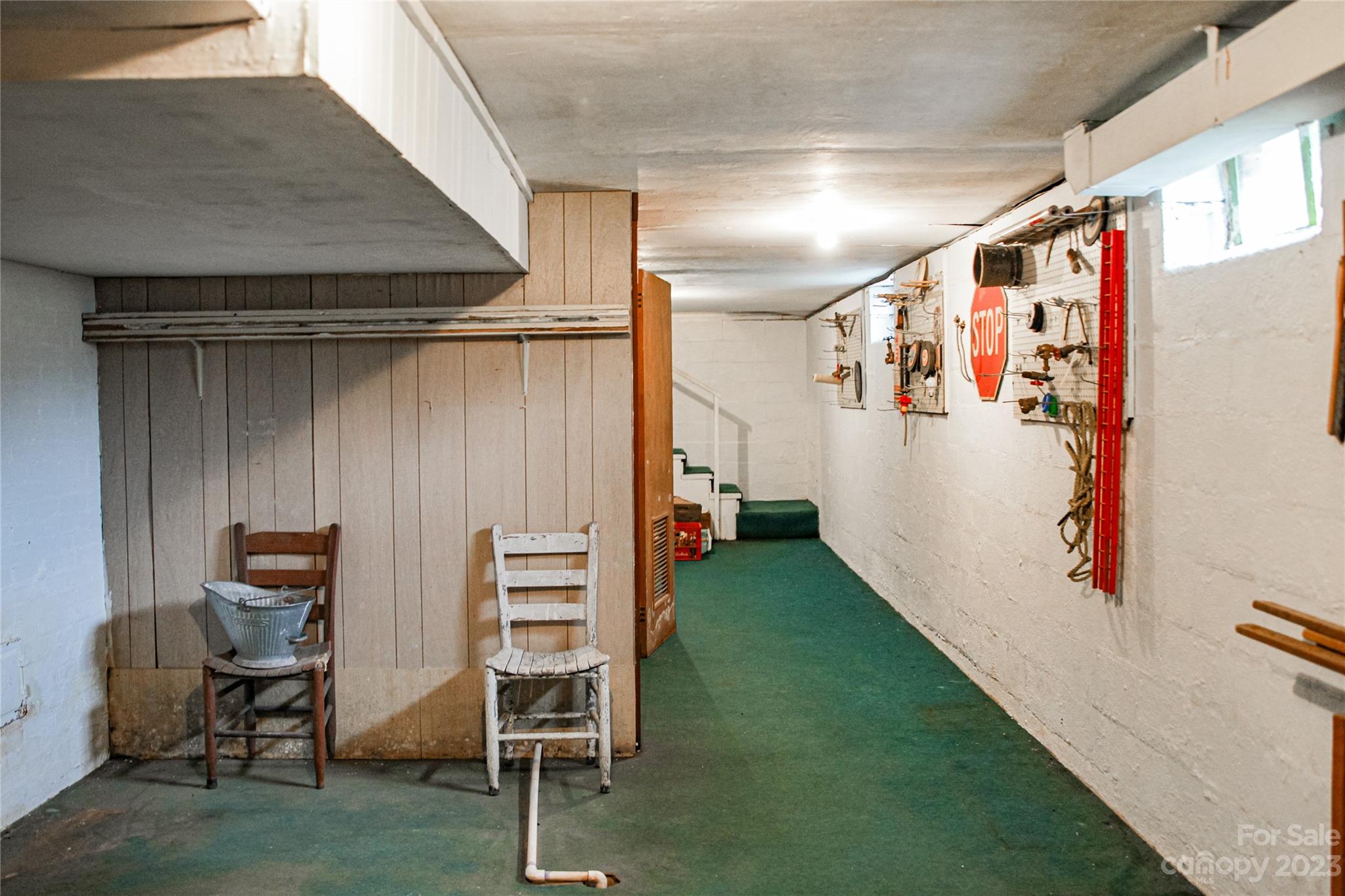 35 Rhododendron Avenue Spruce Pine, NC 28777 - Photo 30 of 37 a view of walk in closet with clothes and shoes