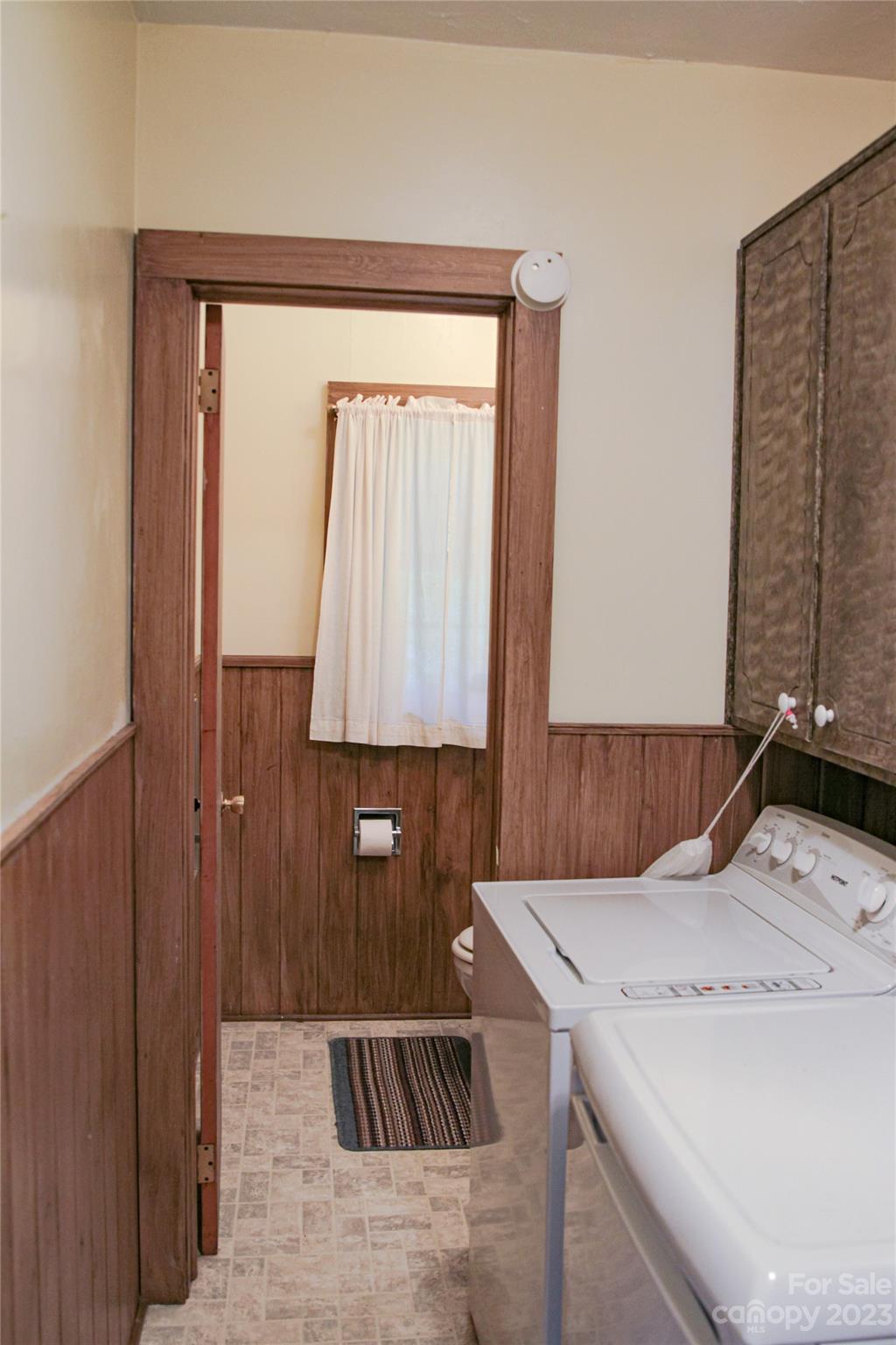 35 Rhododendron Avenue Spruce Pine, NC 28777 - Photo 3 of 37 a bathroom with a sink and a washing machine