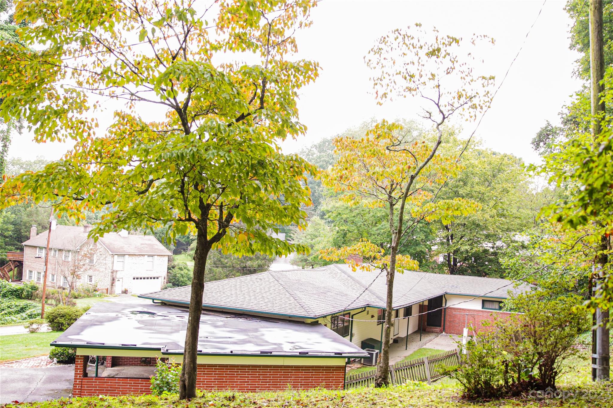 35 Rhododendron Avenue Spruce Pine, NC 28777 - Photo 34 of 37 a view of a patio with table and chairs and potted plants
