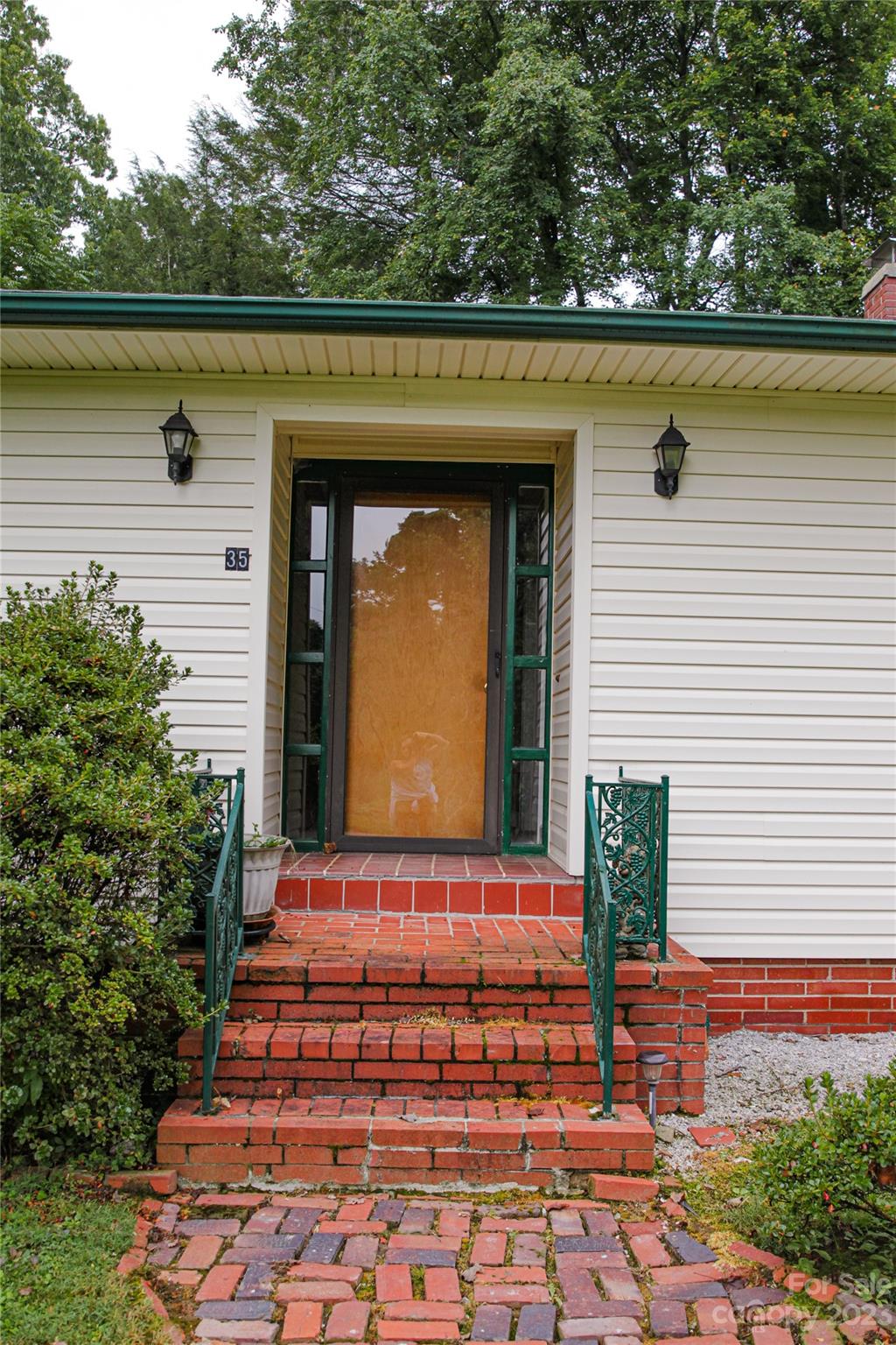 35 Rhododendron Avenue Spruce Pine, NC 28777 - Photo 36 of 37 a front view of a house with lake