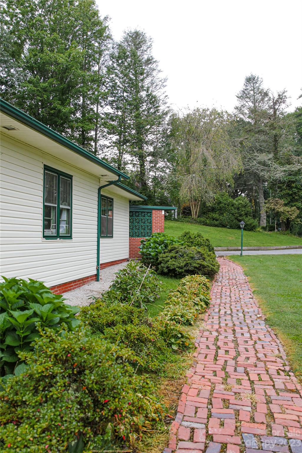 35 Rhododendron Avenue Spruce Pine, NC 28777 - Photo 37 of 37 a front view of a house with garden