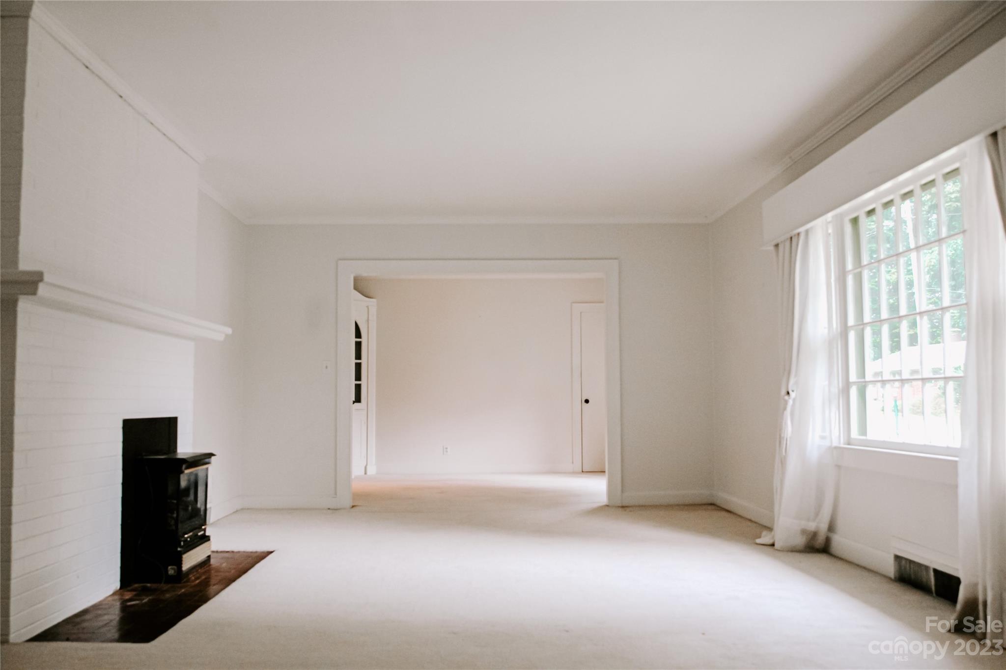 35 Rhododendron Avenue Spruce Pine, NC 28777 - Photo 7 of 37 a view of an empty room with a window