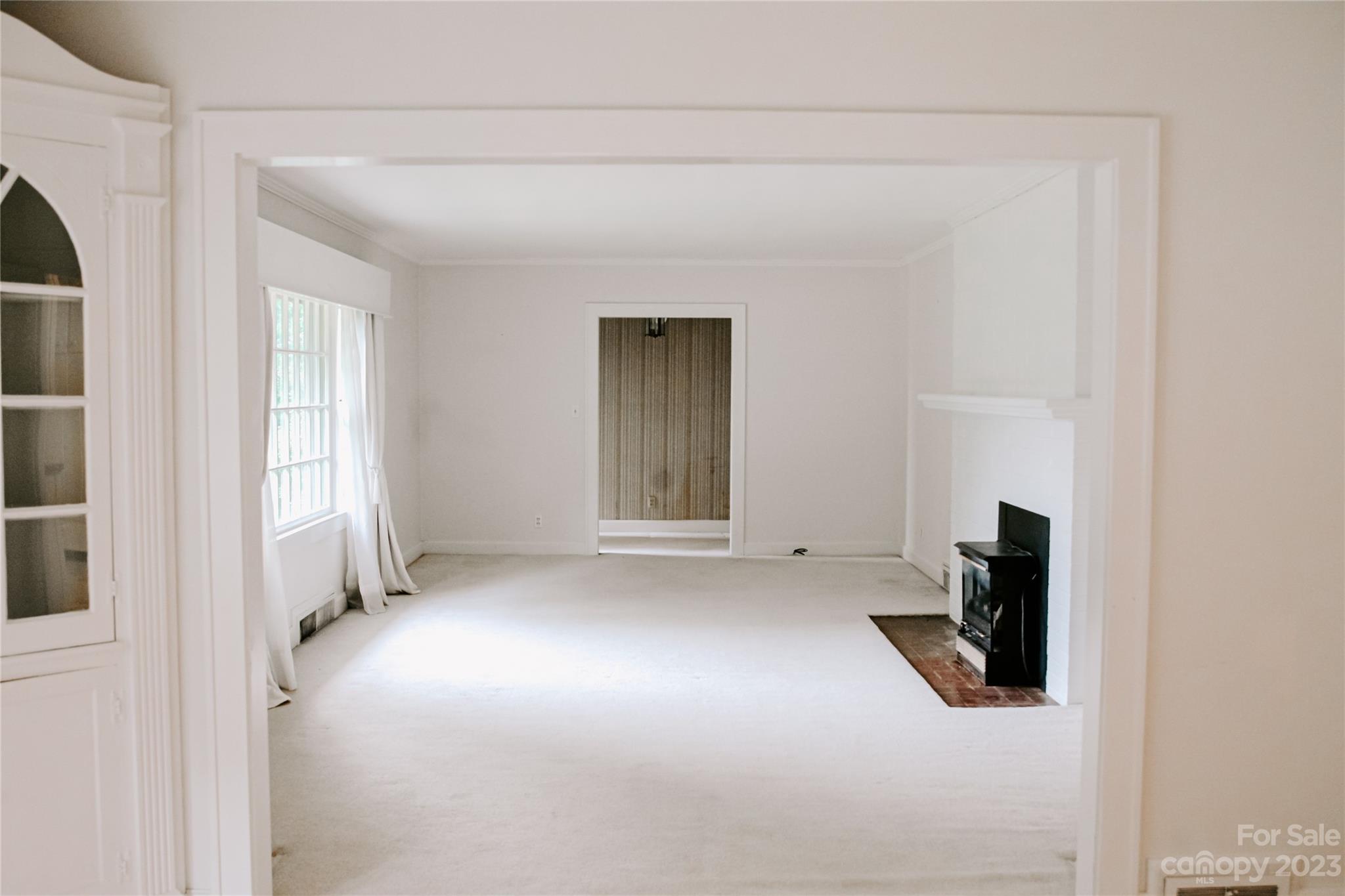 35 Rhododendron Avenue Spruce Pine, NC 28777 - Photo 9 of 37 an empty room with windows
