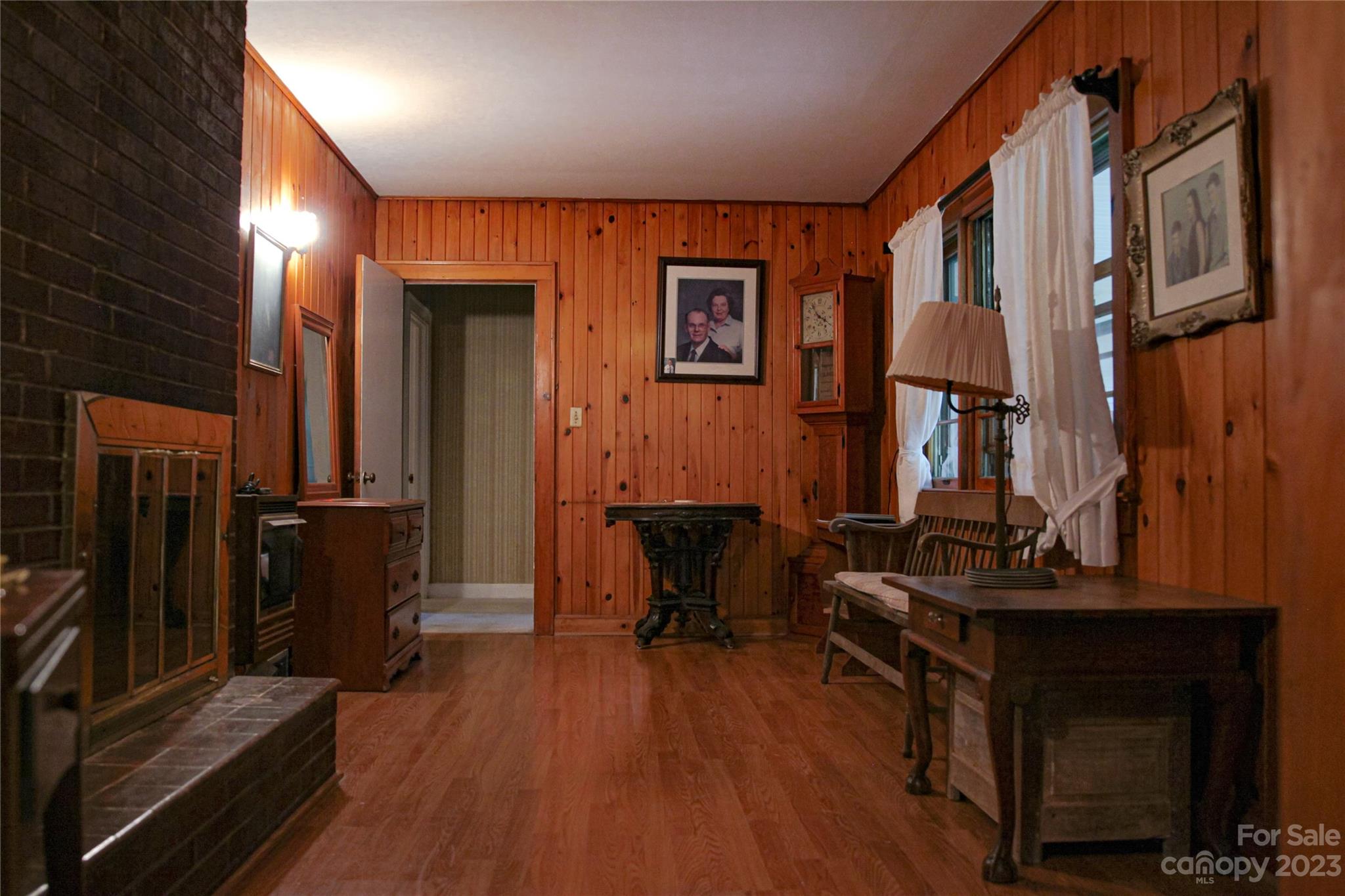 35 Rhododendron Avenue Spruce Pine, NC 28777 - Photo 10 of 37 a view of a livingroom with furniture and a flat screen tv