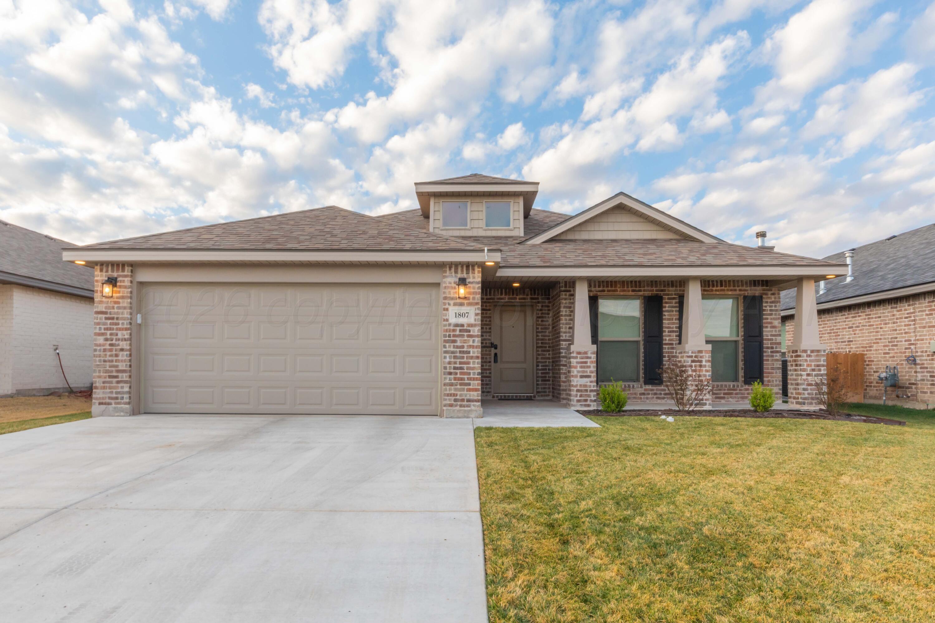 1807 Moon River Road Amarillo, TX 79118 - Photo 1 of 37 a front view of a house with yard and outdoor seating
