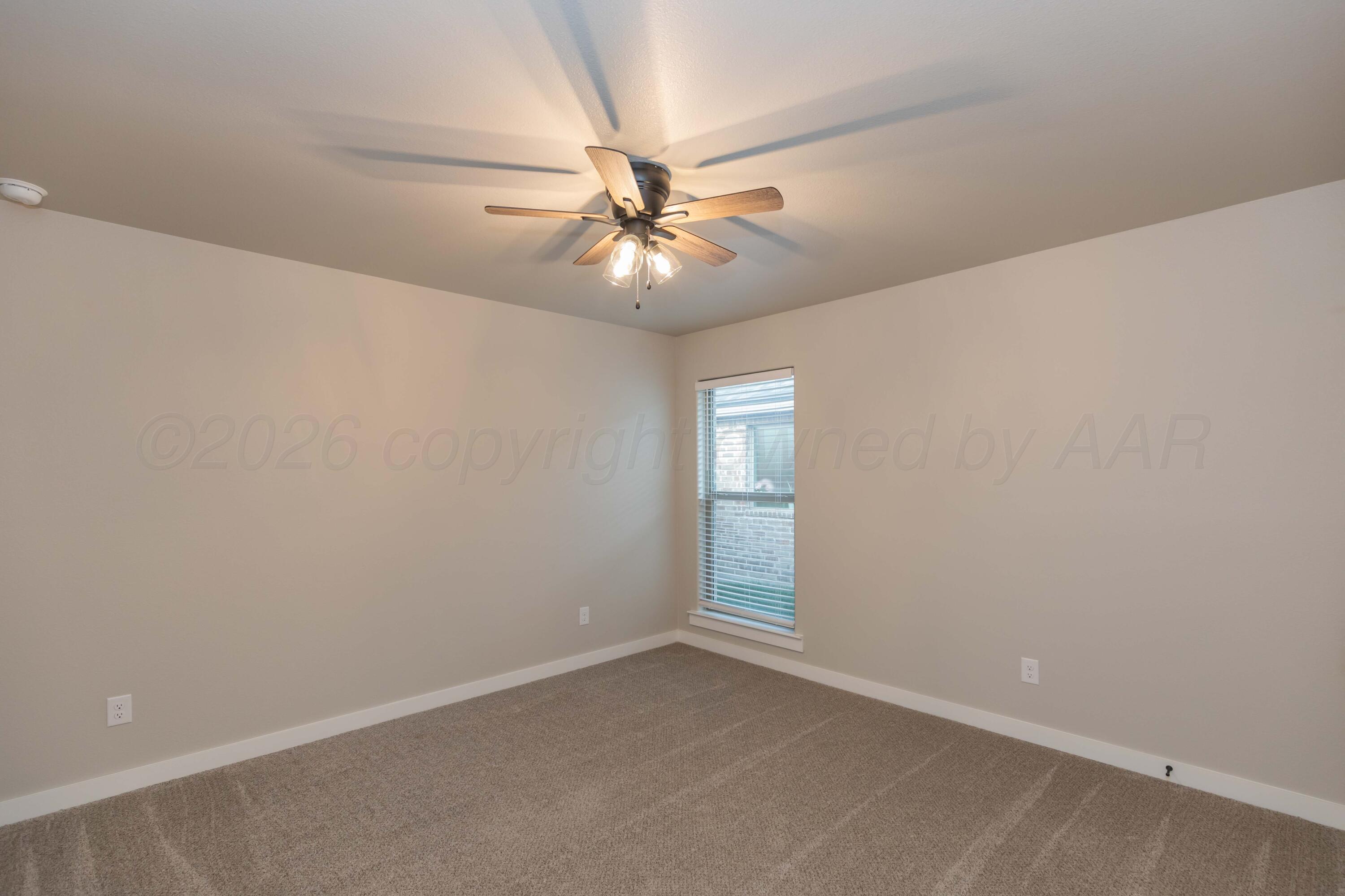 1807 Moon River Road Amarillo, TX 79118 - Photo 23 of 37 an empty room with windows and fan