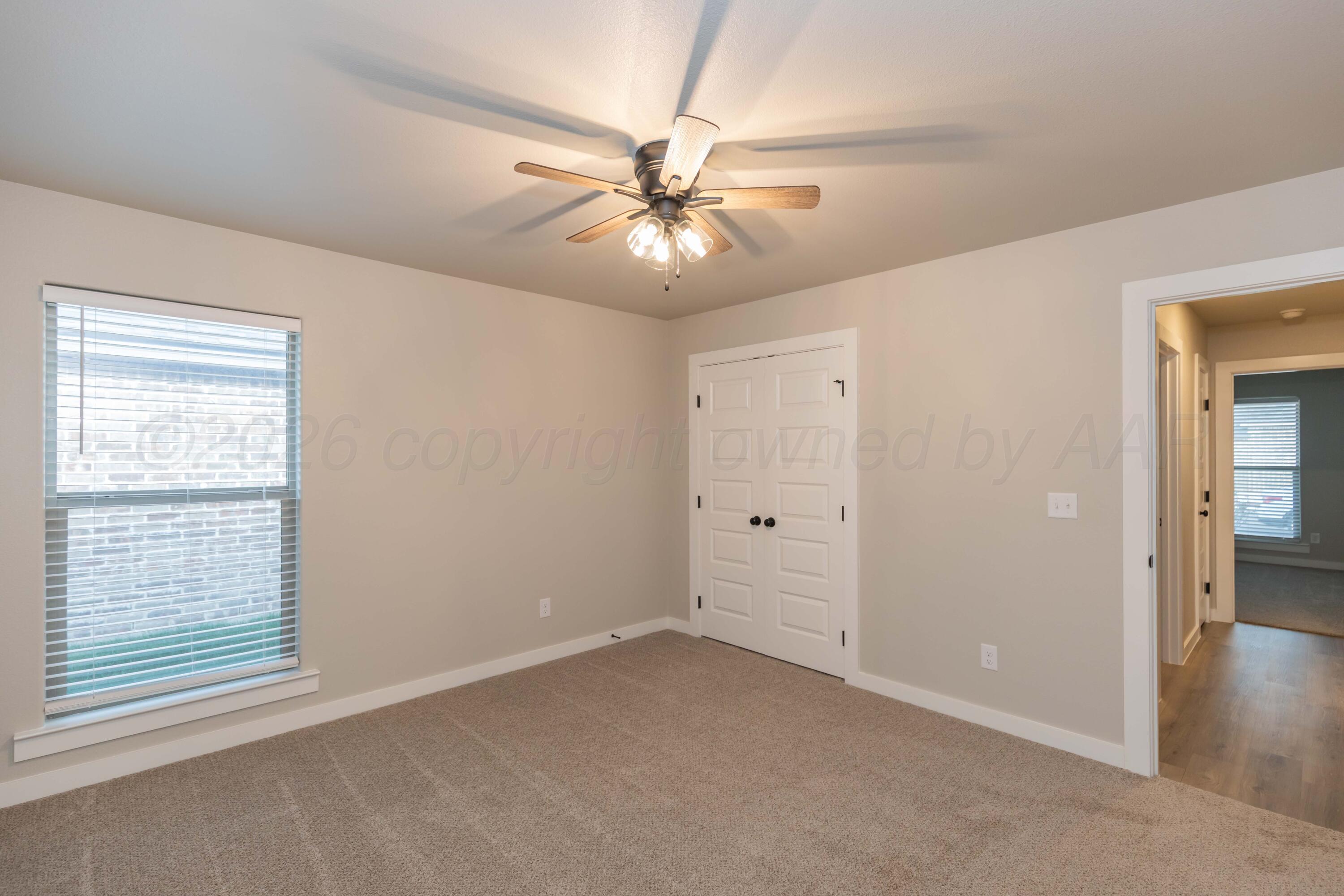 1807 Moon River Road Amarillo, TX 79118 - Photo 24 of 37 an empty room with closet and a chandelier fan