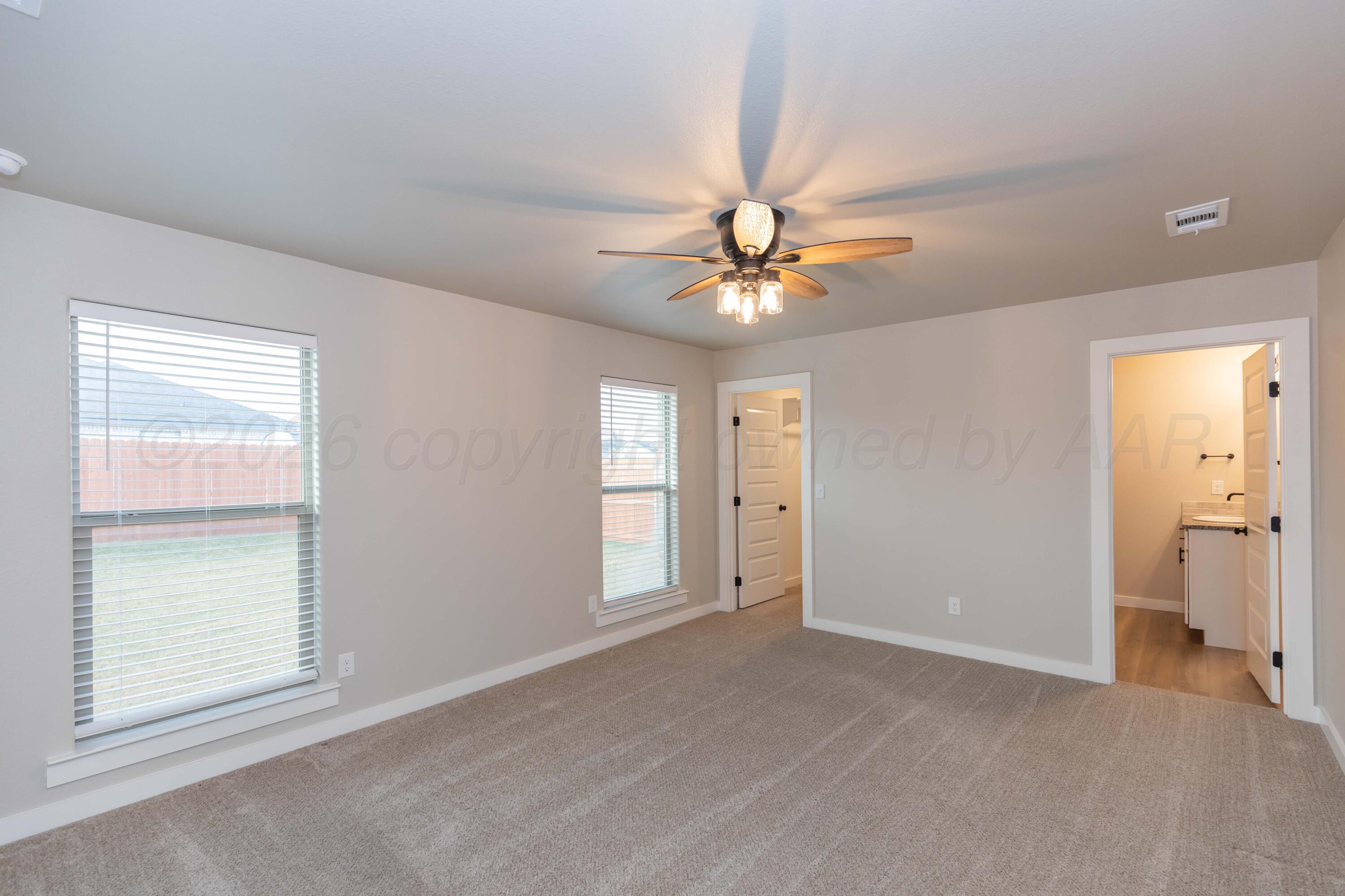 1807 Moon River Road Amarillo, TX 79118 - Photo 27 of 37 a view of an empty room with a window