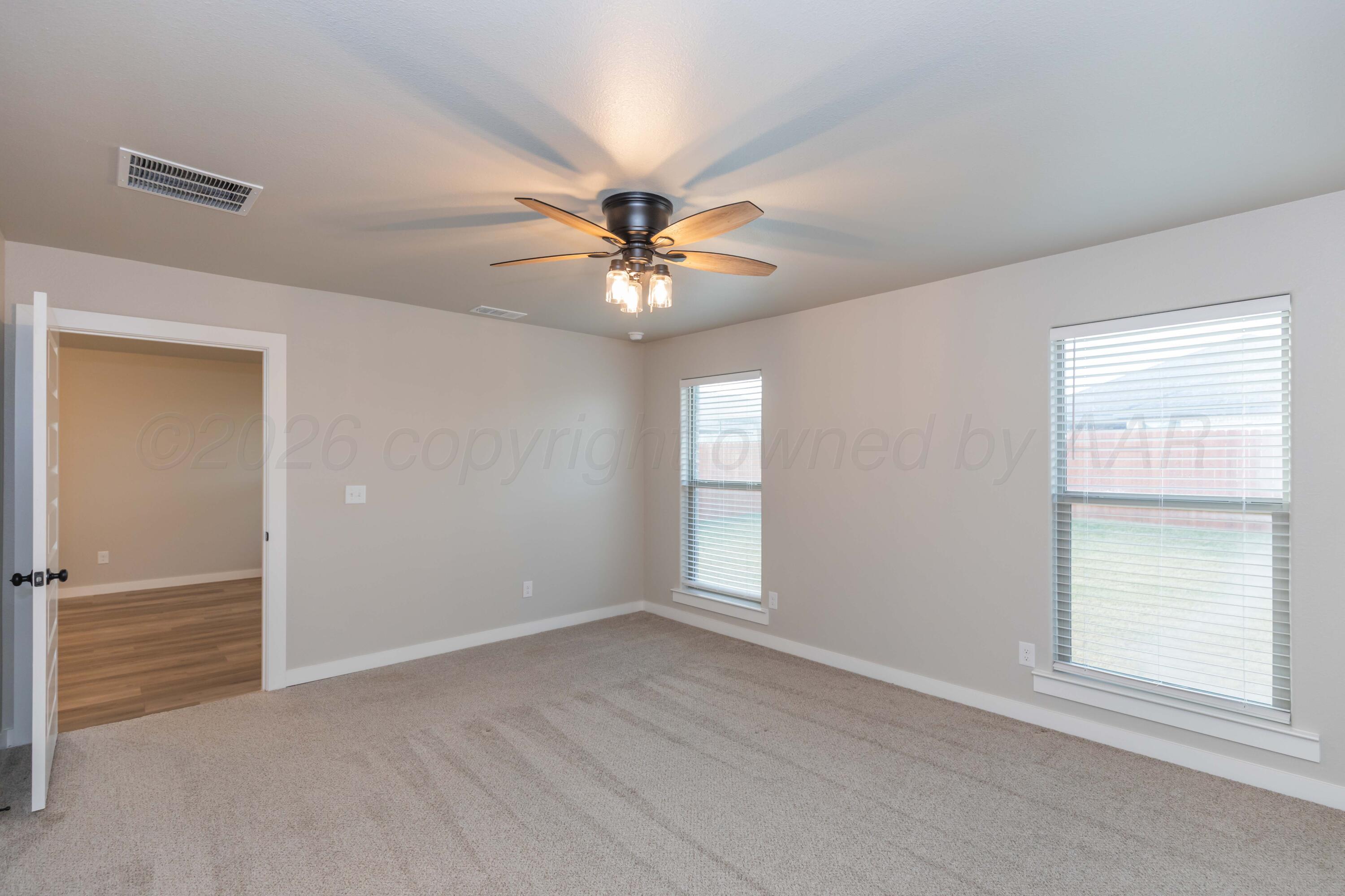 1807 Moon River Road Amarillo, TX 79118 - Photo 30 of 37 a view of an empty room with a window