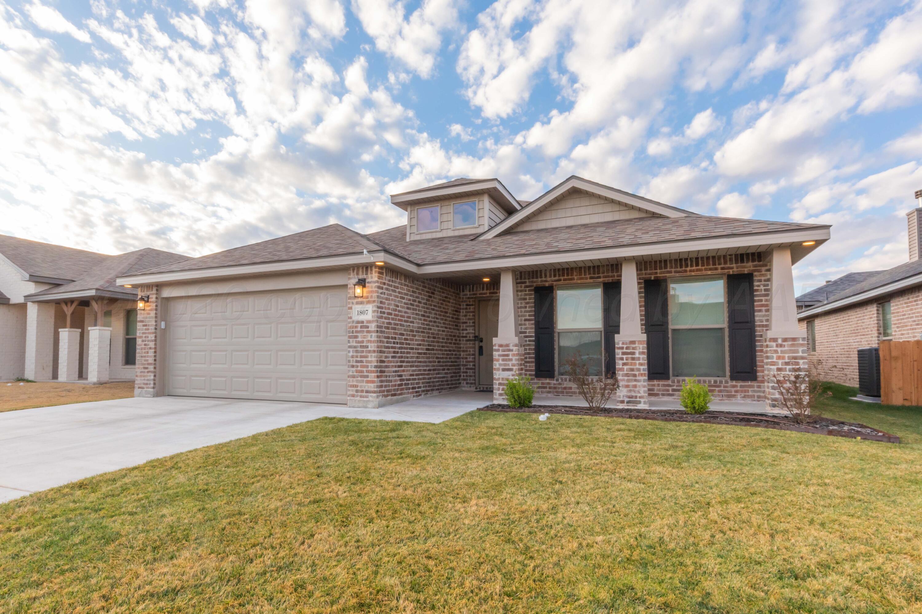 1807 Moon River Road Amarillo, TX 79118 - Photo 3 of 37 a front view of house with yard
