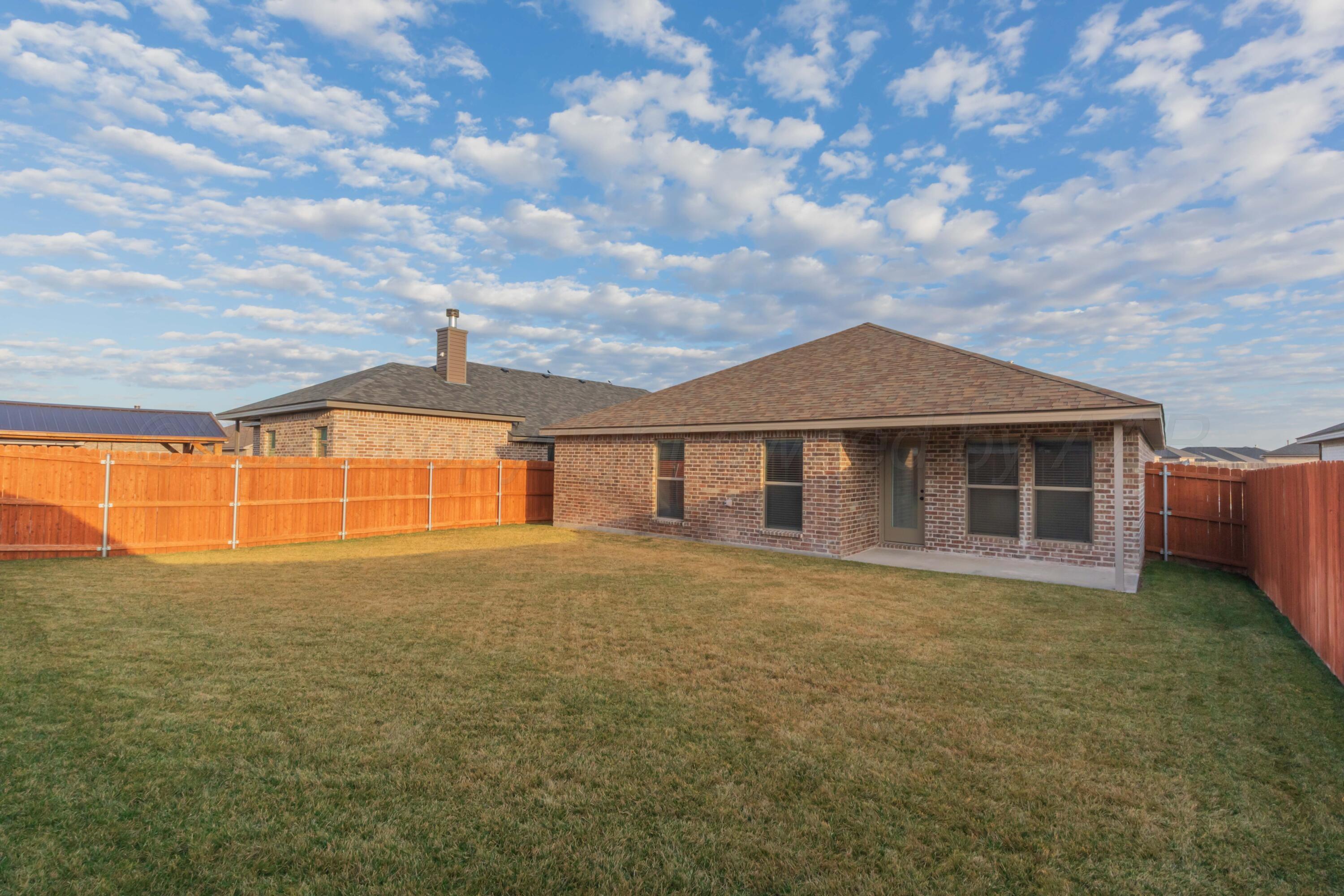 1807 Moon River Road Amarillo, TX 79118 - Photo 36 of 37 a front view of a house with a yard