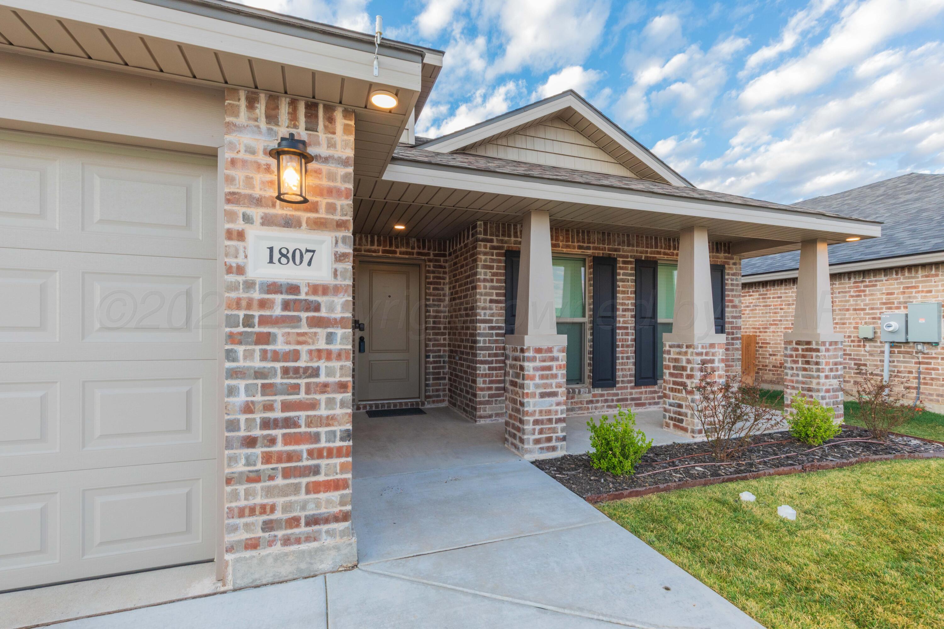 1807 Moon River Road Amarillo, TX 79118 - Photo 4 of 37 a front view of a house with patio
