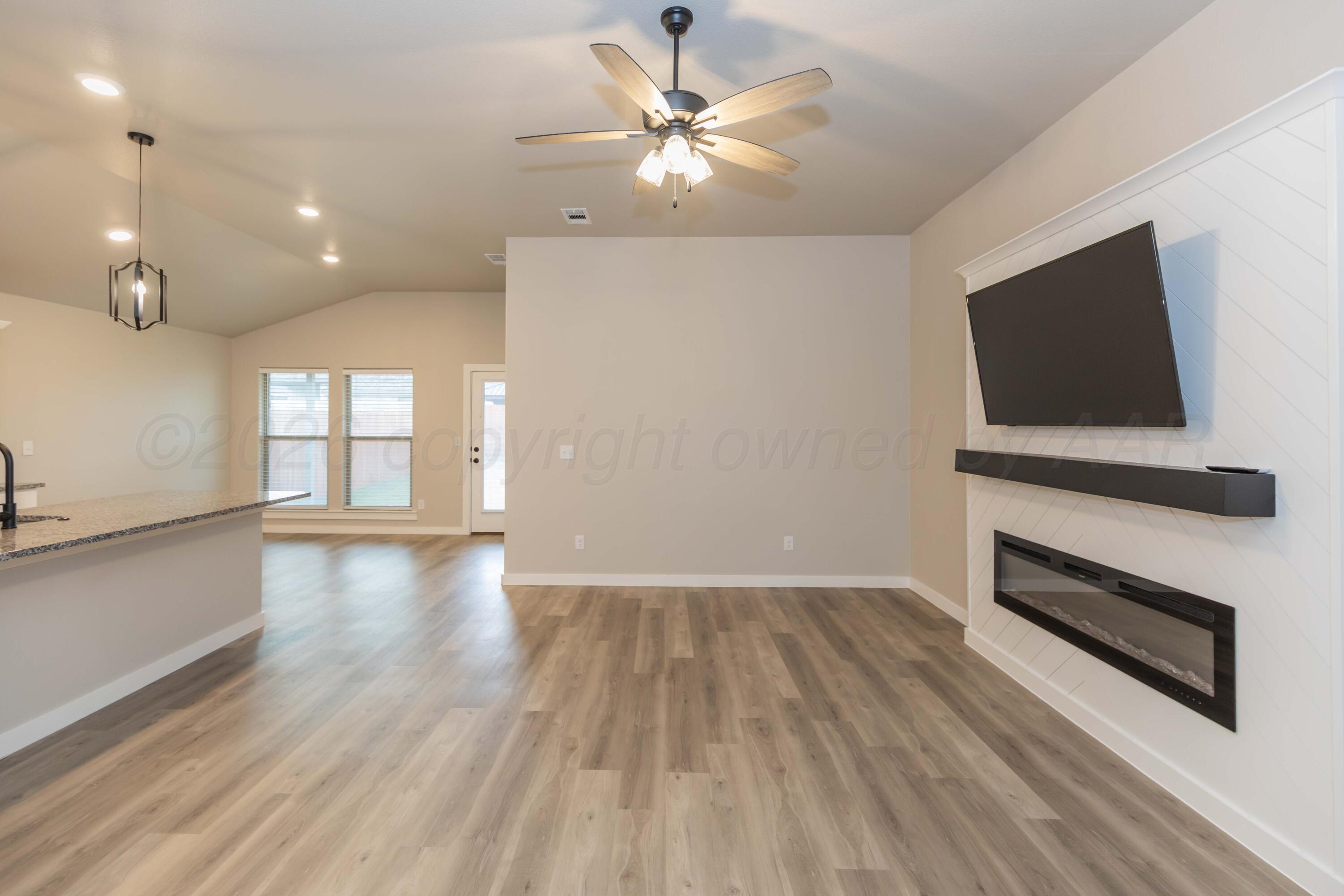 1807 Moon River Road Amarillo, TX 79118 - Photo 9 of 37 a view of livingroom with furniture and flat screen tv