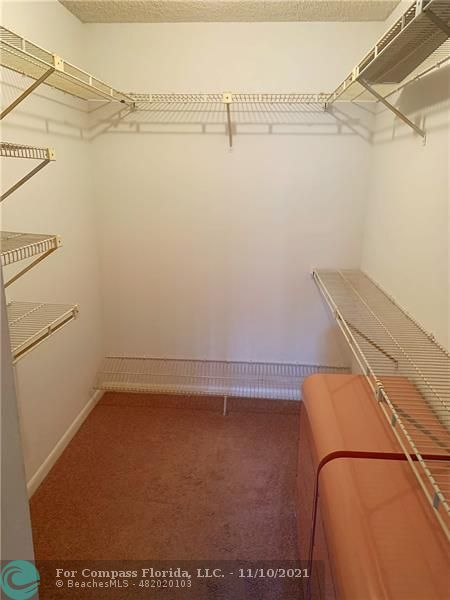 Kings Point Delray Beach, FL 33484 - Photo 15 of 20 a view of a room with racks on the wall