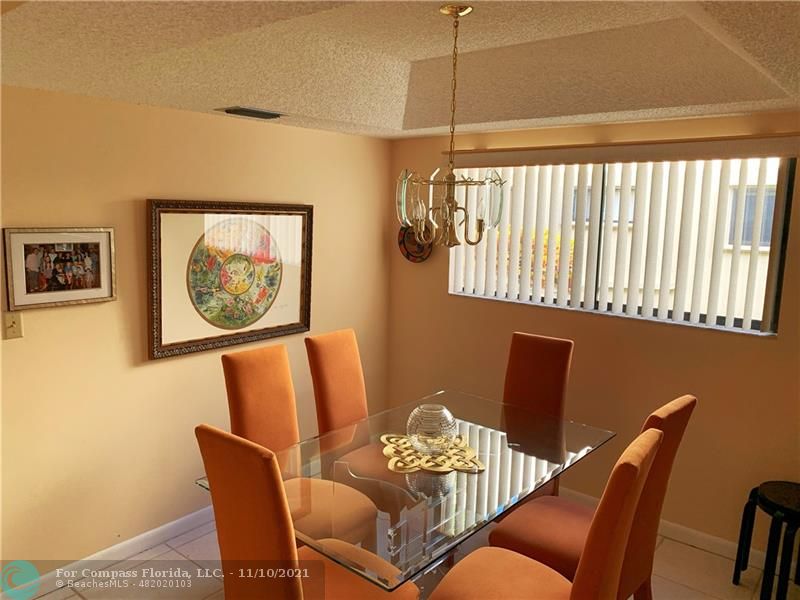 Kings Point Delray Beach, FL 33484 - Photo 9 of 20 a view of a dining room with furniture and a window