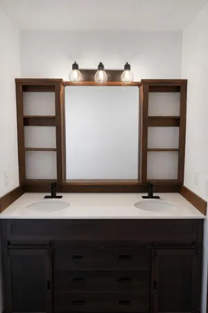 a bathroom with a sink and a mirror