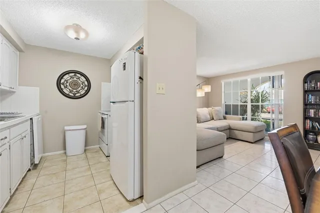 a living room with furniture a clock and a window