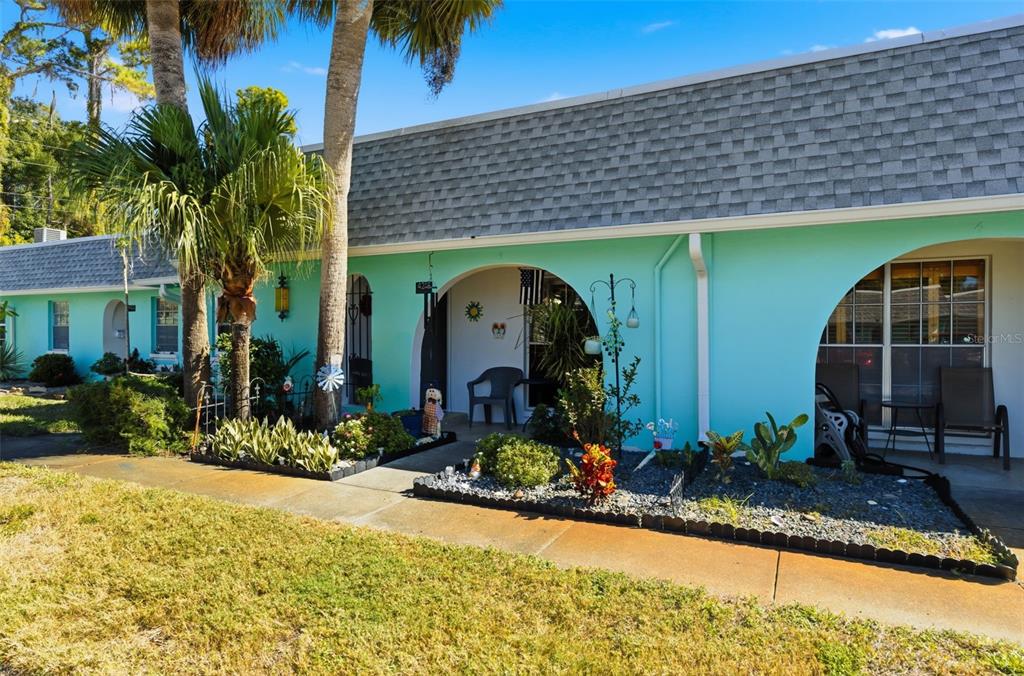 4218 Terrapin Place, Unit D New Port Richey, FL 34652 - Photo 15 of 34 a front view of a house with garden