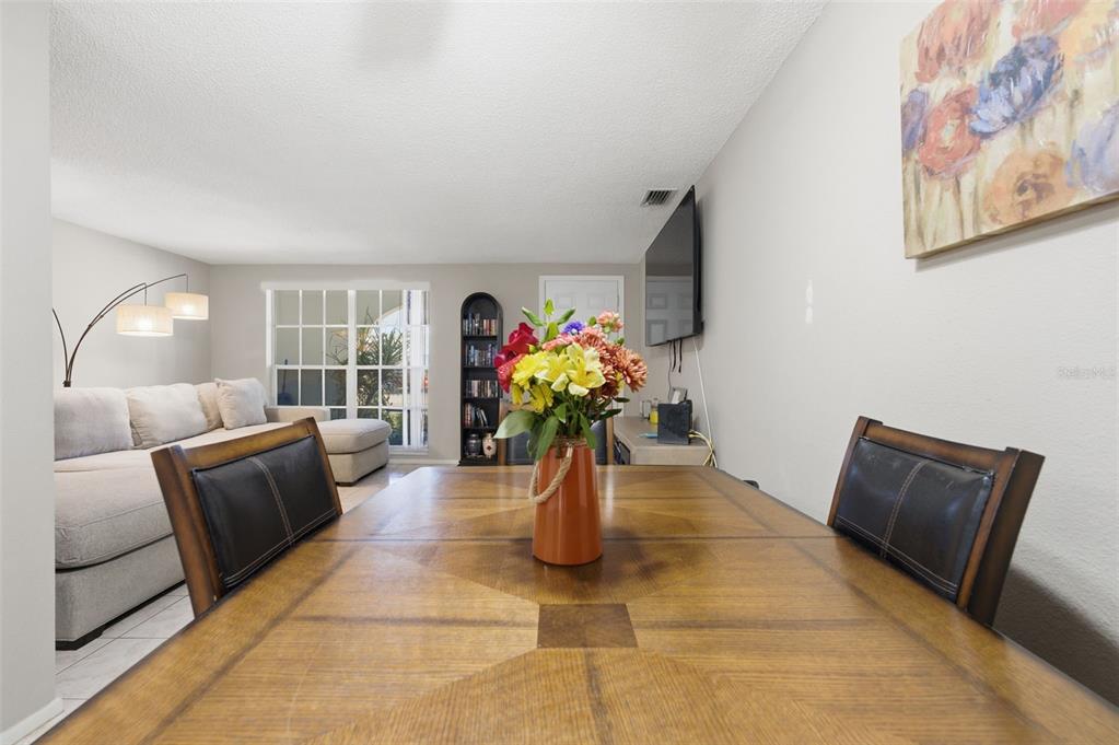 4218 Terrapin Place, Unit D New Port Richey, FL 34652 - Photo 17 of 34 a living room with furniture flowerpot and wooden floor