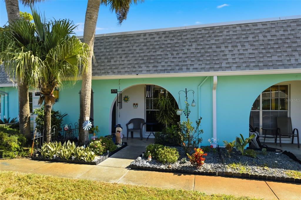 4218 Terrapin Place, Unit D New Port Richey, FL 34652 - Photo 19 of 34 a front view of a house with garden