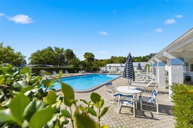 a view of a chairs and table in patio