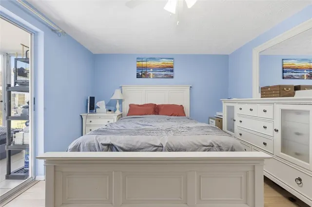 a bedroom with a bed and a dresser