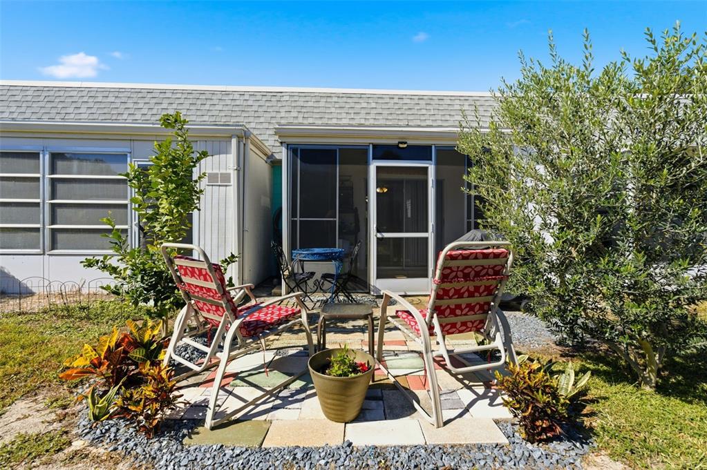 4218 Terrapin Place, Unit D New Port Richey, FL 34652 - Photo 31 of 34 front view of house with outdoor seating