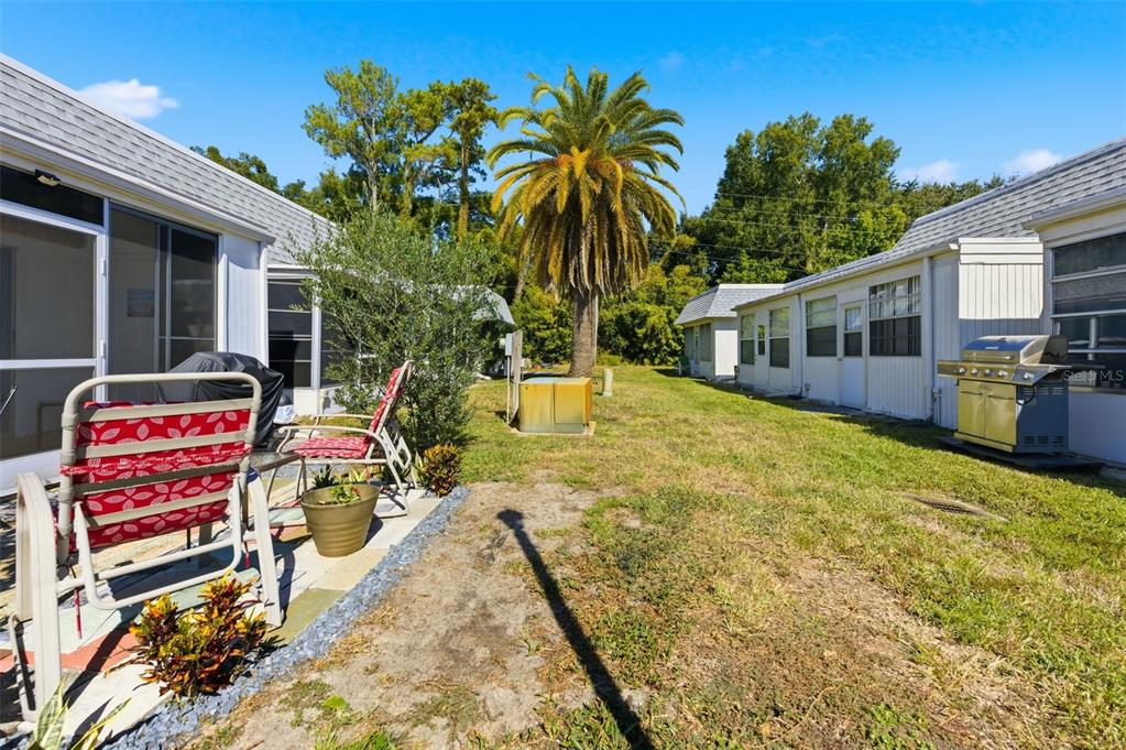 4218 Terrapin Place, Unit D New Port Richey, FL 34652 - Photo 33 of 34 a view of a house with backyard and sitting area