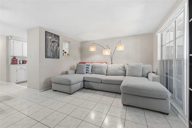 a living room with furniture and a large window